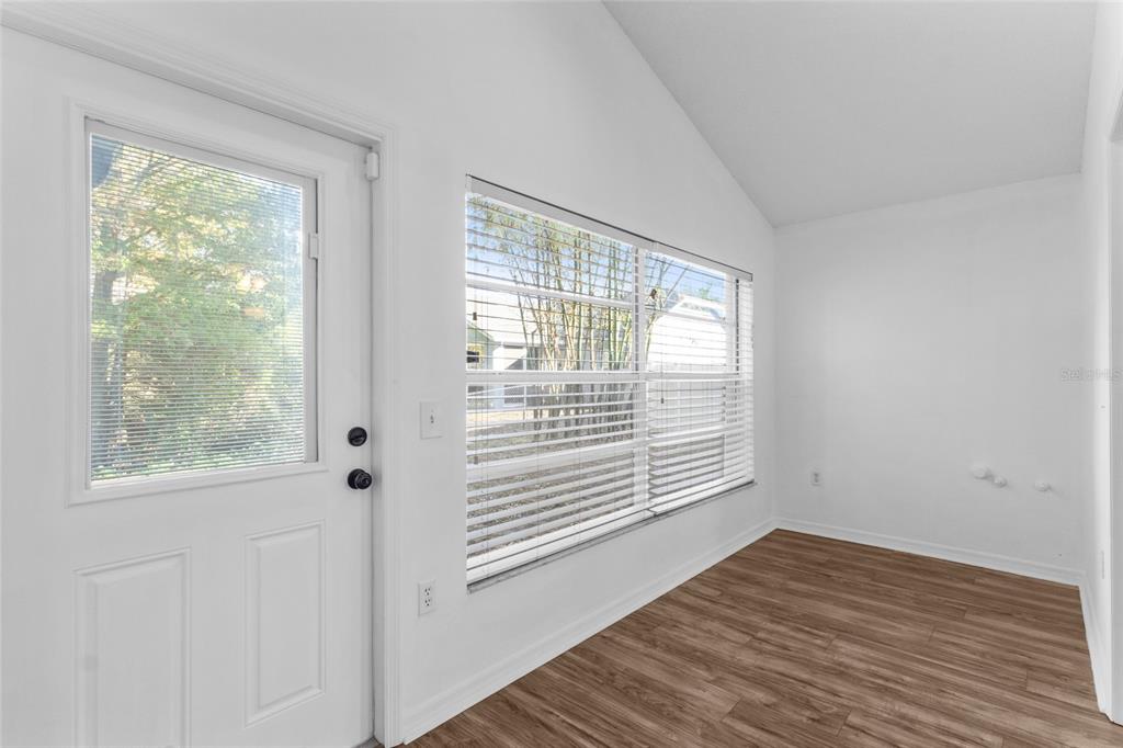 4644 Sawgrass Boulevard New Port Richey, FL 34653 - Photo 4 of 34 a view of an empty room with wooden floor and a window
