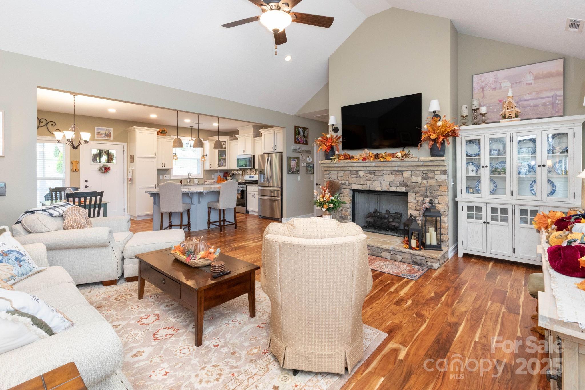 605 Red Bank Road Waynesville, NC 28786 - Photo 11 of 34 a living room with furniture a flat screen tv and a fireplace
