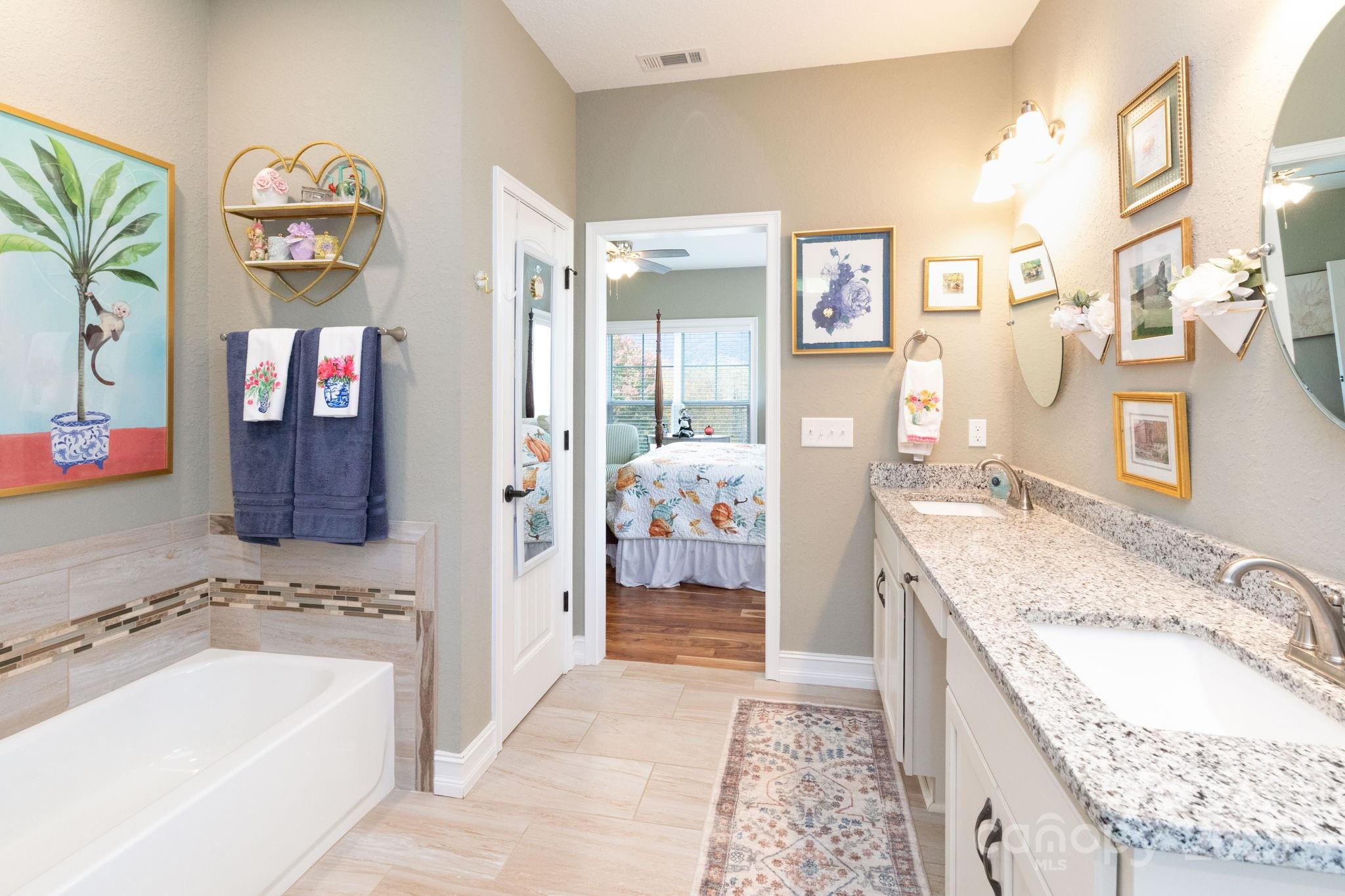 605 Red Bank Road Waynesville, NC 28786 - Photo 16 of 34 a spacious bathroom with a granite countertop tub sink and mirror