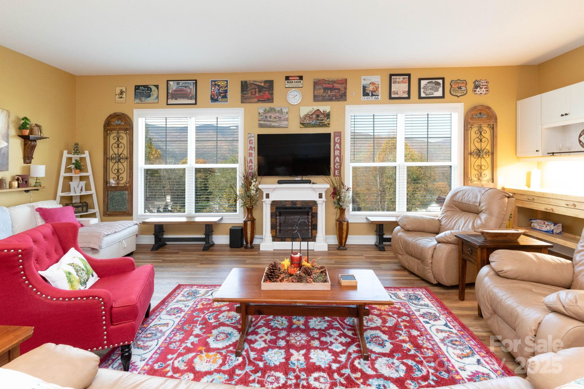 605 Red Bank Road Waynesville, NC 28786 - Photo 22 of 34 a living room with furniture fireplace and a large window