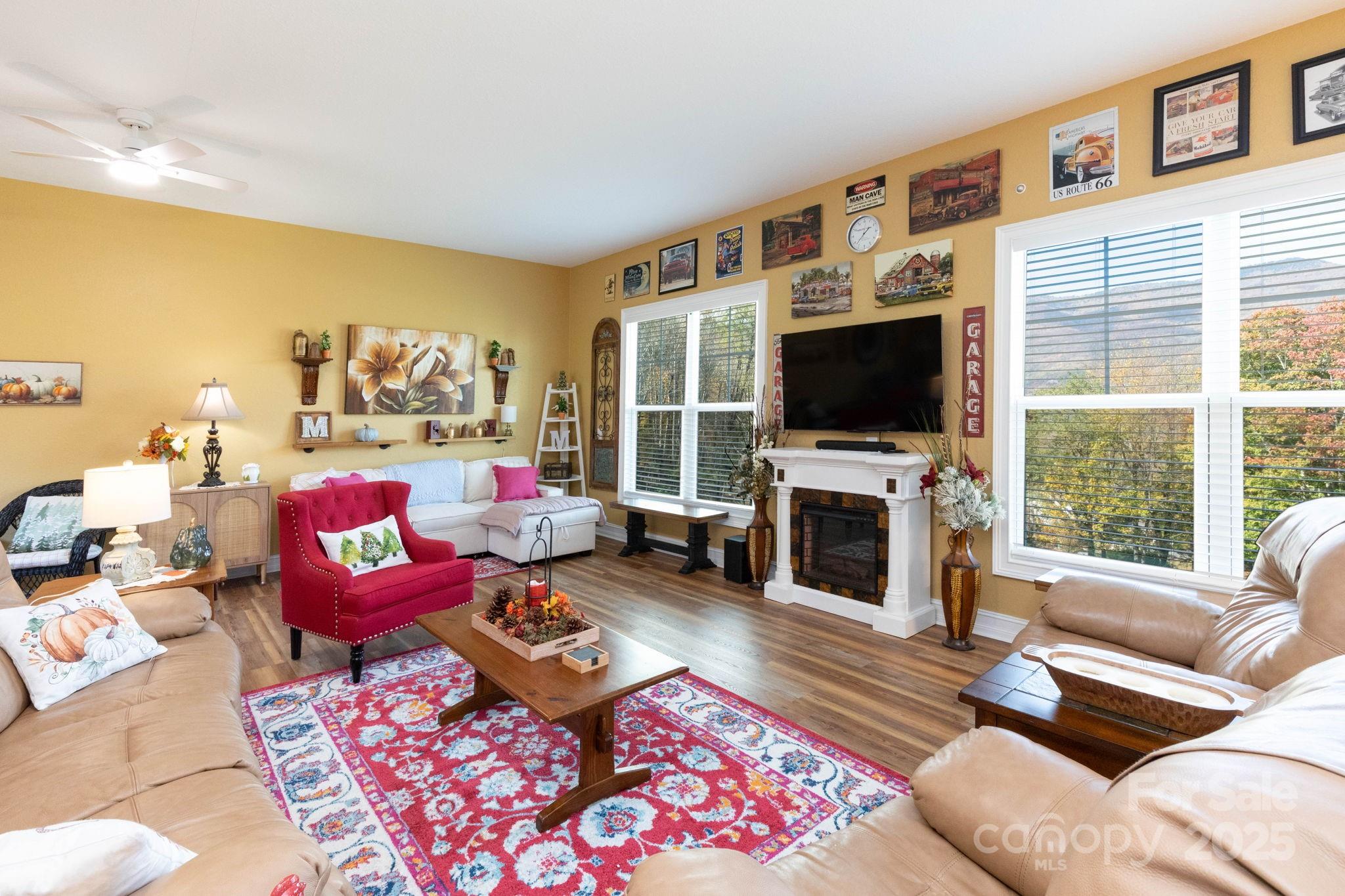 605 Red Bank Road Waynesville, NC 28786 - Photo 24 of 34 a living room with furniture a flat screen tv and a fireplace