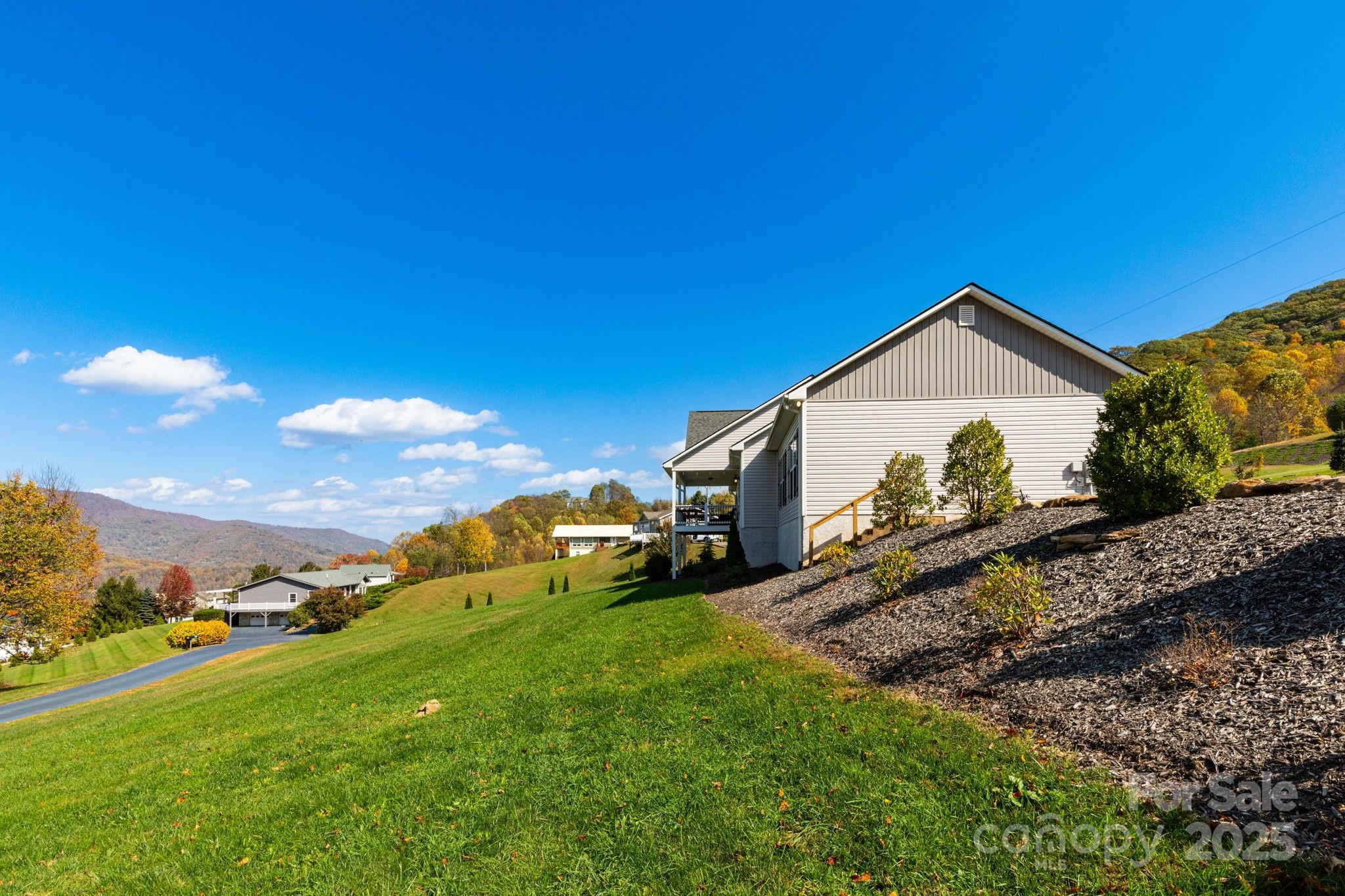 605 Red Bank Road Waynesville, NC 28786 - Photo 25 of 34 a view of a house with a yard
