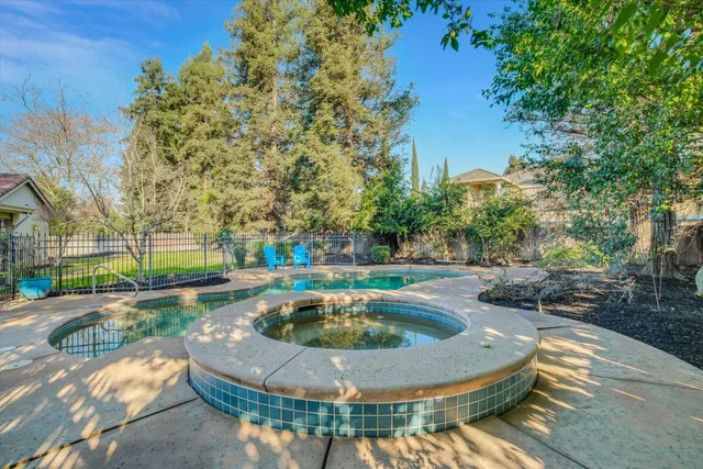 a view of a swimming pool with a patio