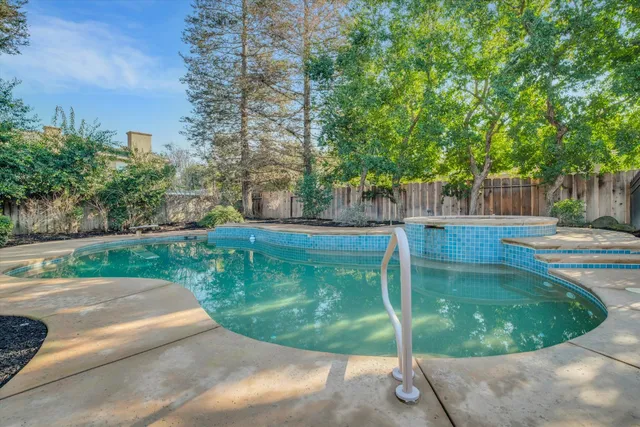 a view of a swimming pool with a sitting area