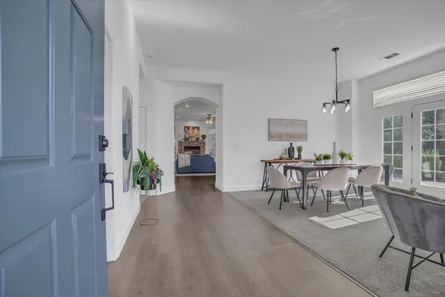 a view of a dining room with furniture and window