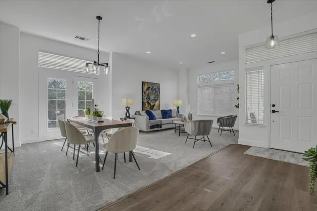 a view of a dining room with furniture window and wooden floor