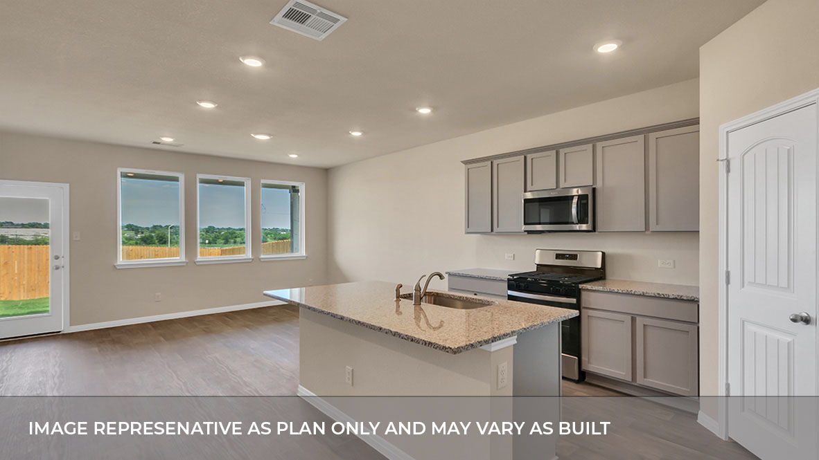 193 Balmorhea Street Kyle, TX 78640 - Photo 18 of 29 a kitchen with stainless steel appliances granite countertop a sink stove and microwave