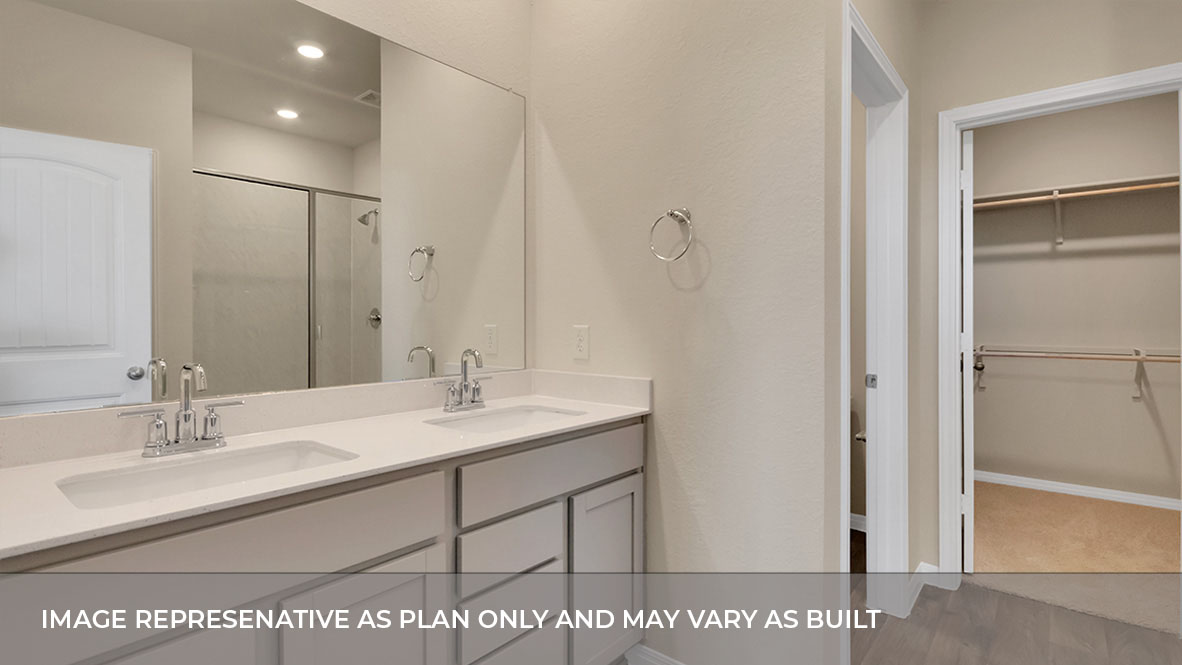 193 Balmorhea Street Kyle, TX 78640 - Photo 25 of 32 a bathroom with a sink a mirror and a shower