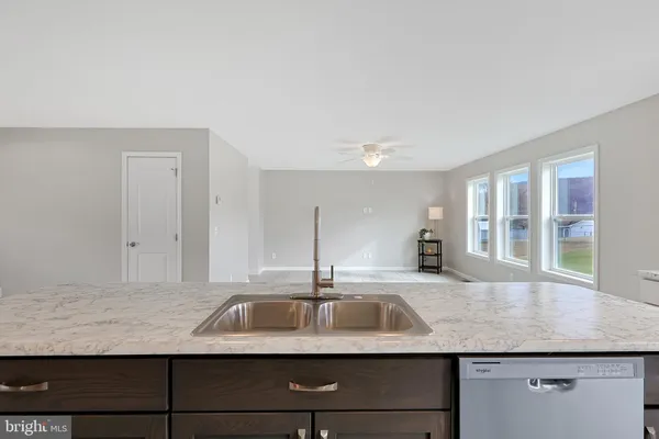 a kitchen with a refrigerator and a sink
