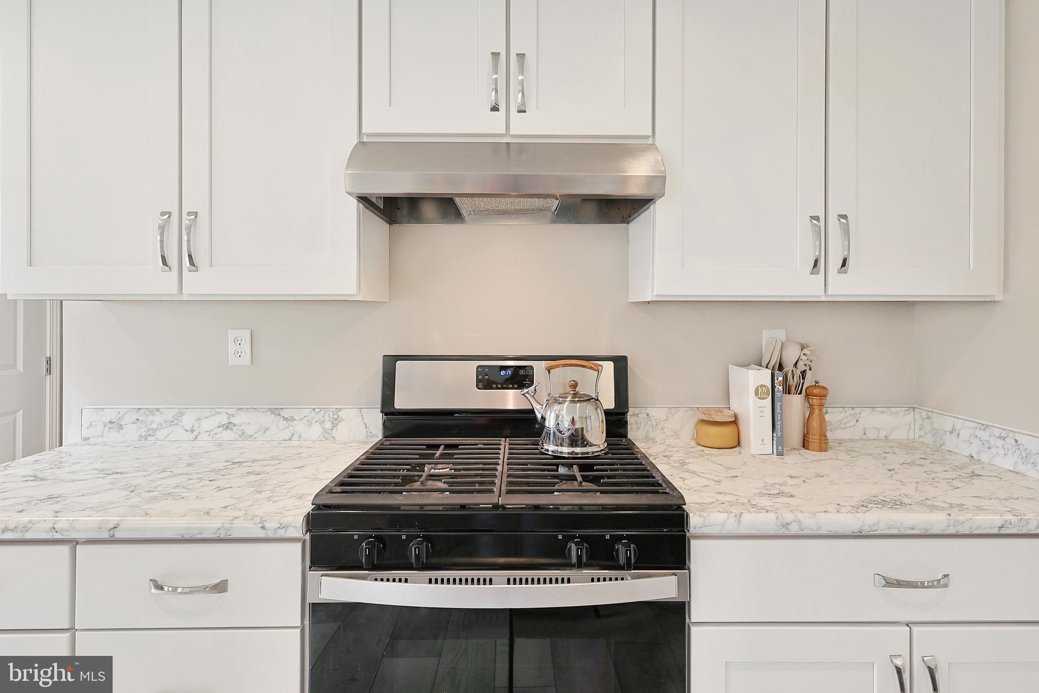 1525 Beacon Street Keyser, WV 26726 - Photo 11 of 59 a stove top oven sitting inside of a kitchen