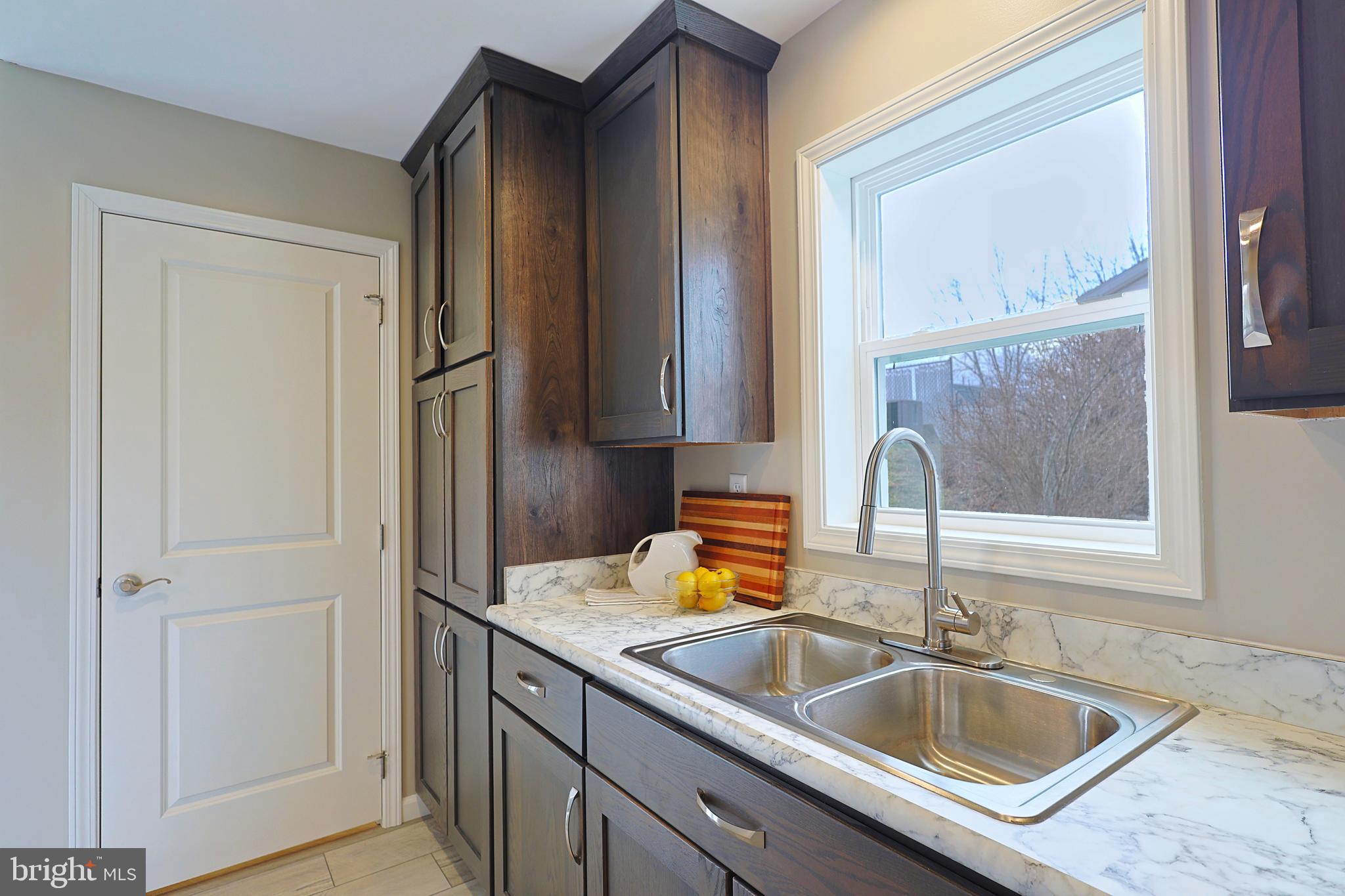 1525 Beacon Street Keyser, WV 26726 - Photo 16 of 59 a bathroom with a sink and a mirror