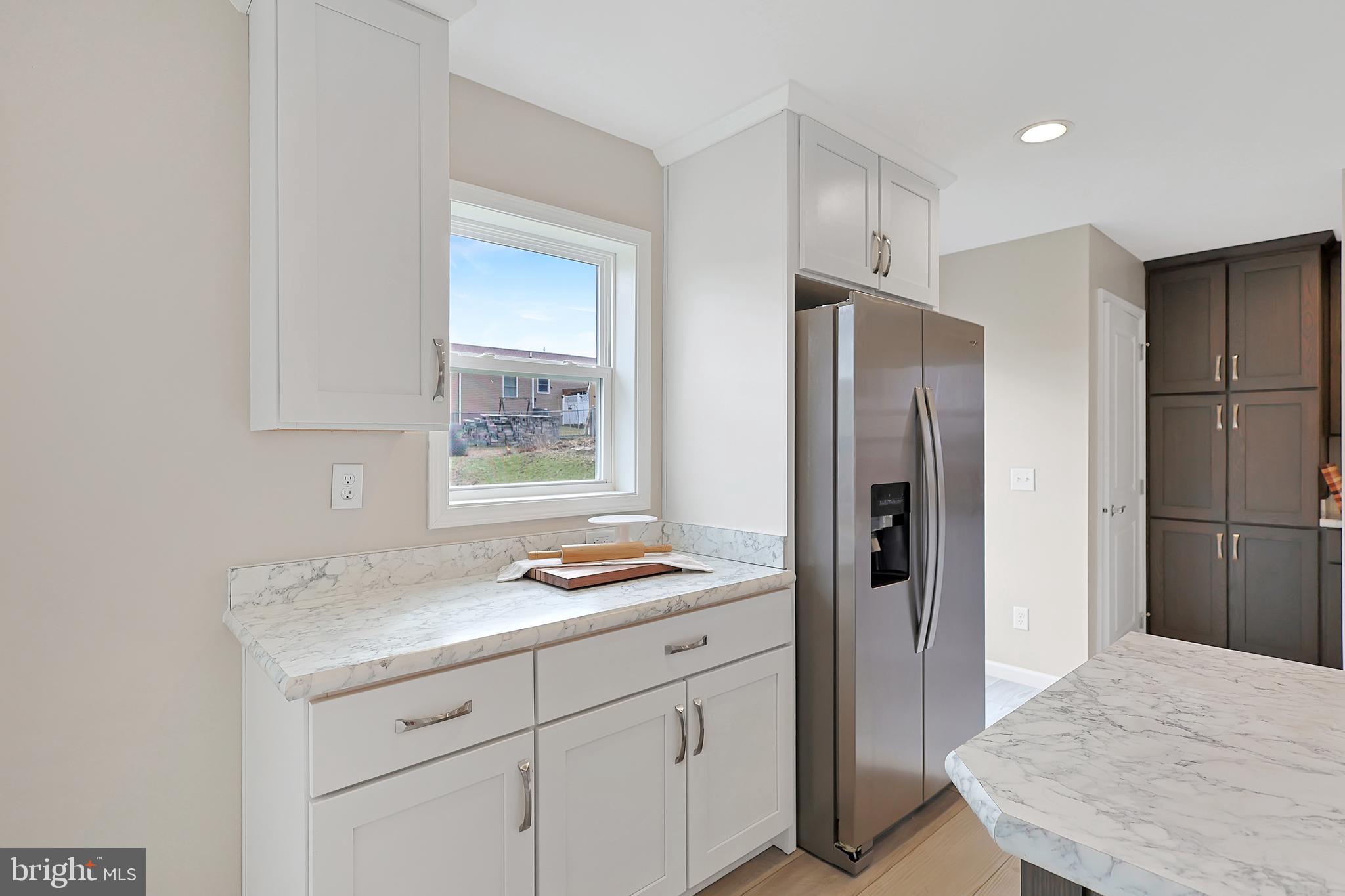 1525 Beacon Street Keyser, WV 26726 - Photo 16 of 67 a kitchen with a refrigerator and a sink