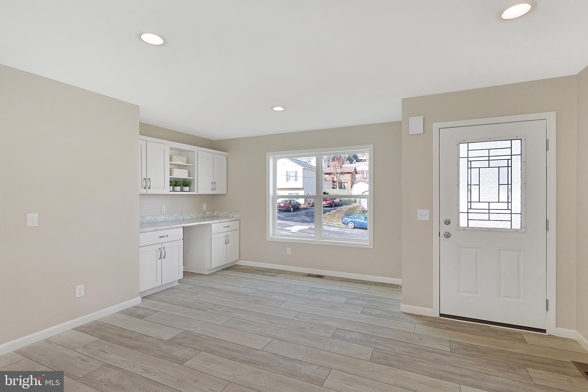 1525 Beacon Street Keyser, WV 26726 - Photo 25 of 67 an empty room with wooden floor and windows