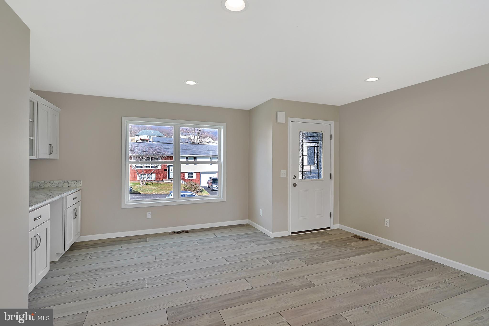 1525 Beacon Street Keyser, WV 26726 - Photo 27 of 67 an empty room with wooden floor and windows