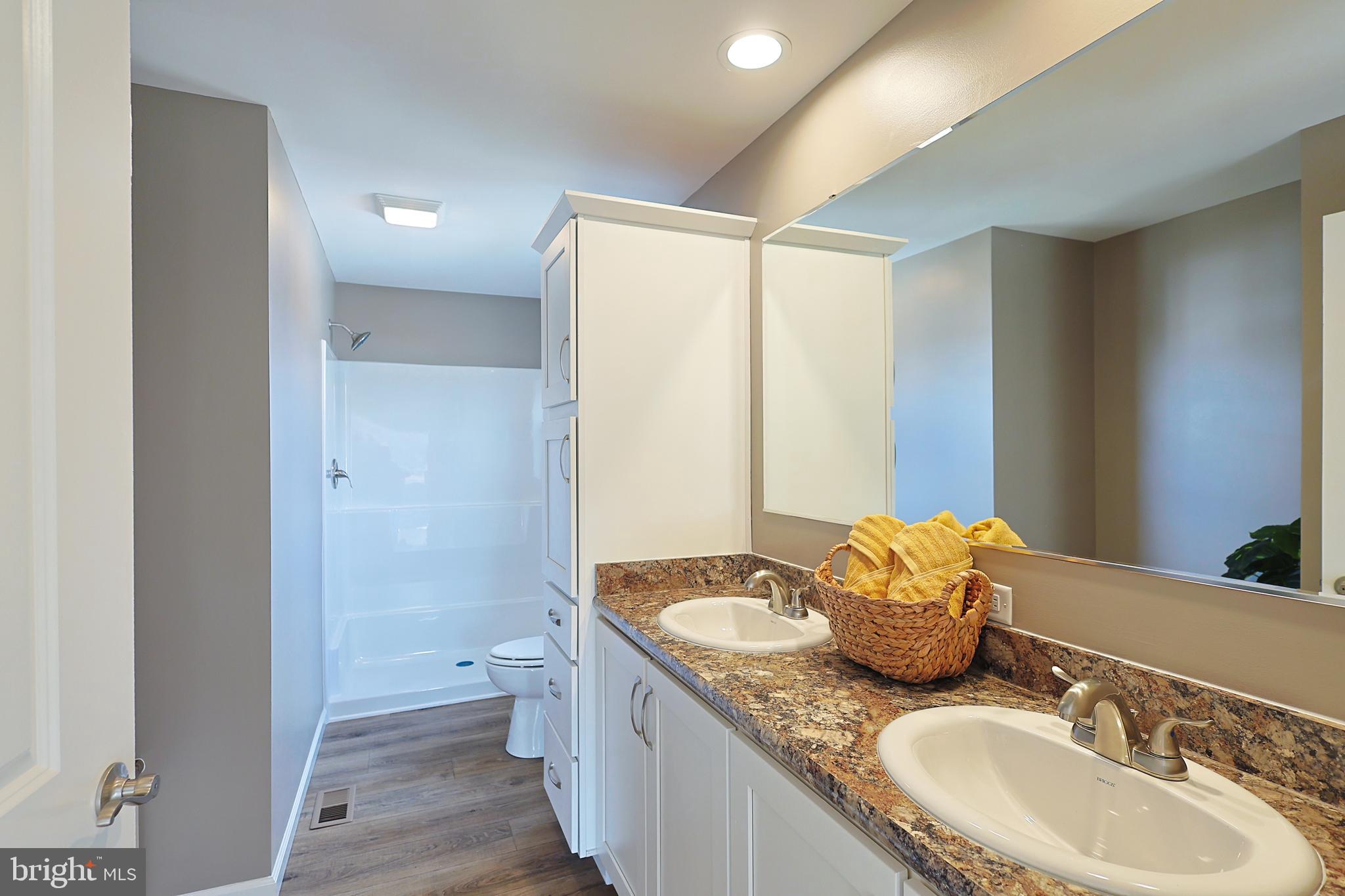 1525 Beacon Street Keyser, WV 26726 - Photo 40 of 67 a bathroom with a granite countertop sink toilet and shower