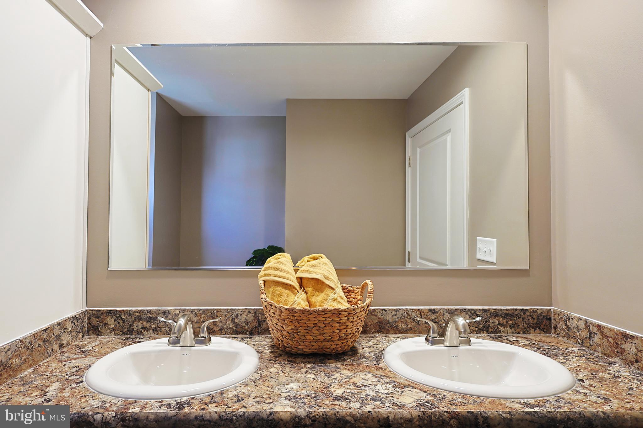 1525 Beacon Street Keyser, WV 26726 - Photo 41 of 67 a bathroom with a granite countertop sink and a mirror
