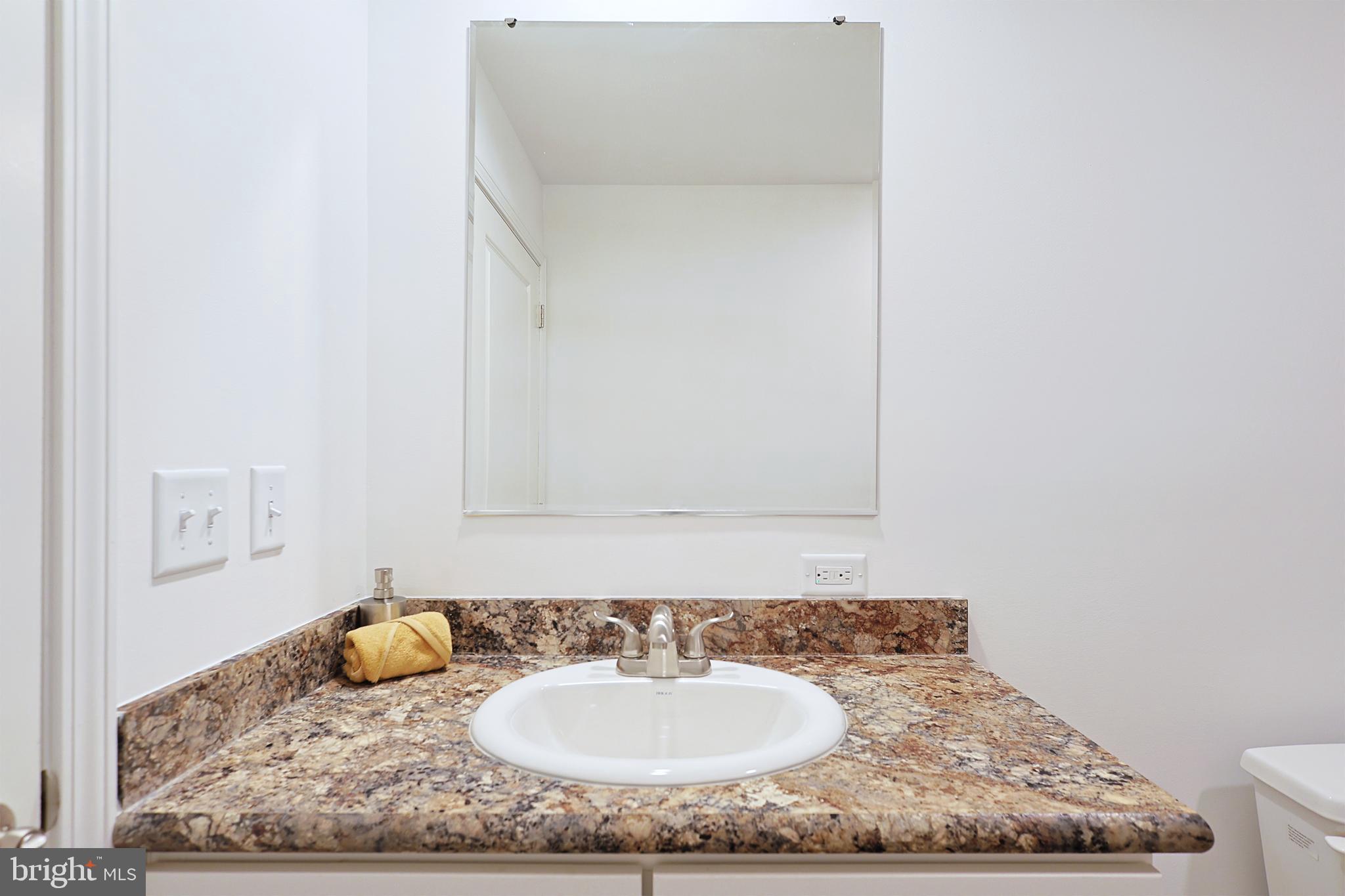 1525 Beacon Street Keyser, WV 26726 - Photo 47 of 59 a bathroom with a granite countertop sink and a mirror