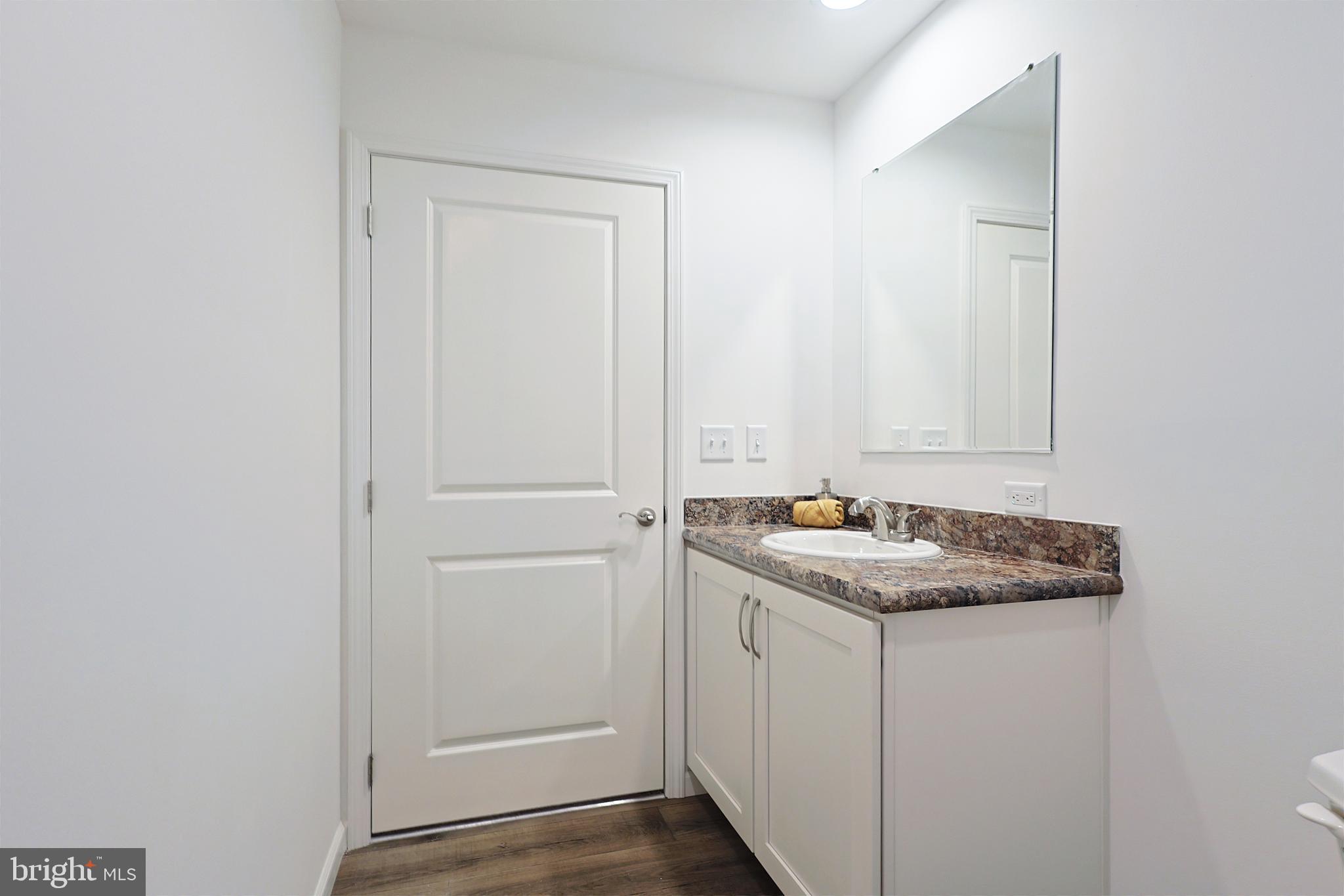 1525 Beacon Street Keyser, WV 26726 - Photo 48 of 59 a bathroom with a sink and mirror
