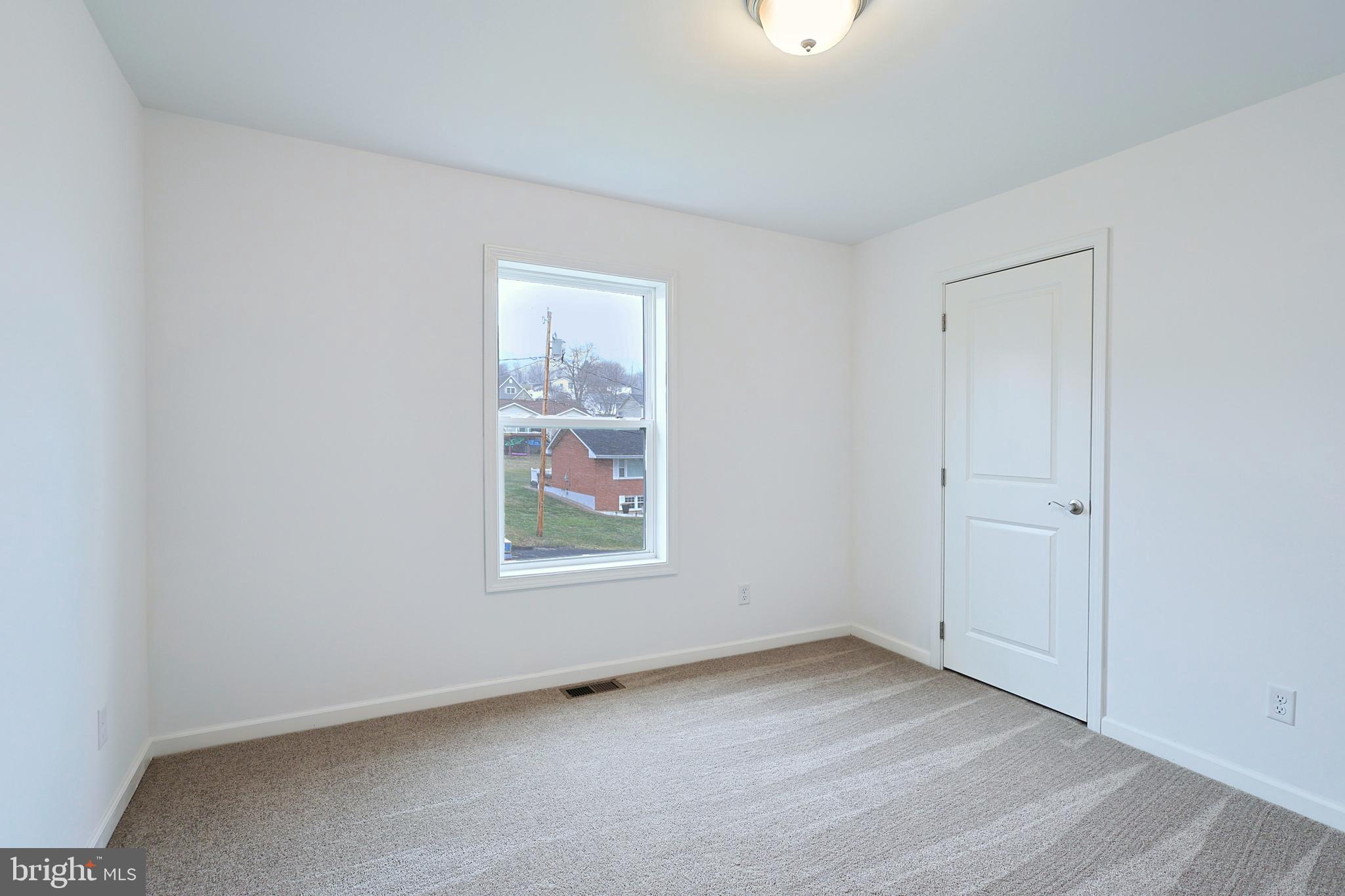 1525 Beacon Street Keyser, WV 26726 - Photo 51 of 59 an empty room with windows