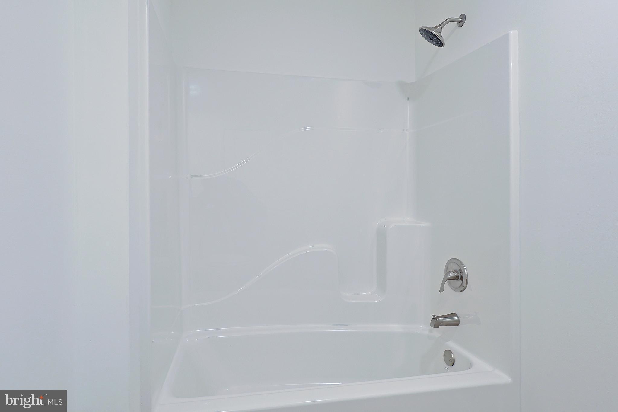 1525 Beacon Street Keyser, WV 26726 - Photo 51 of 67 a close up of a bathtub in a bathroom