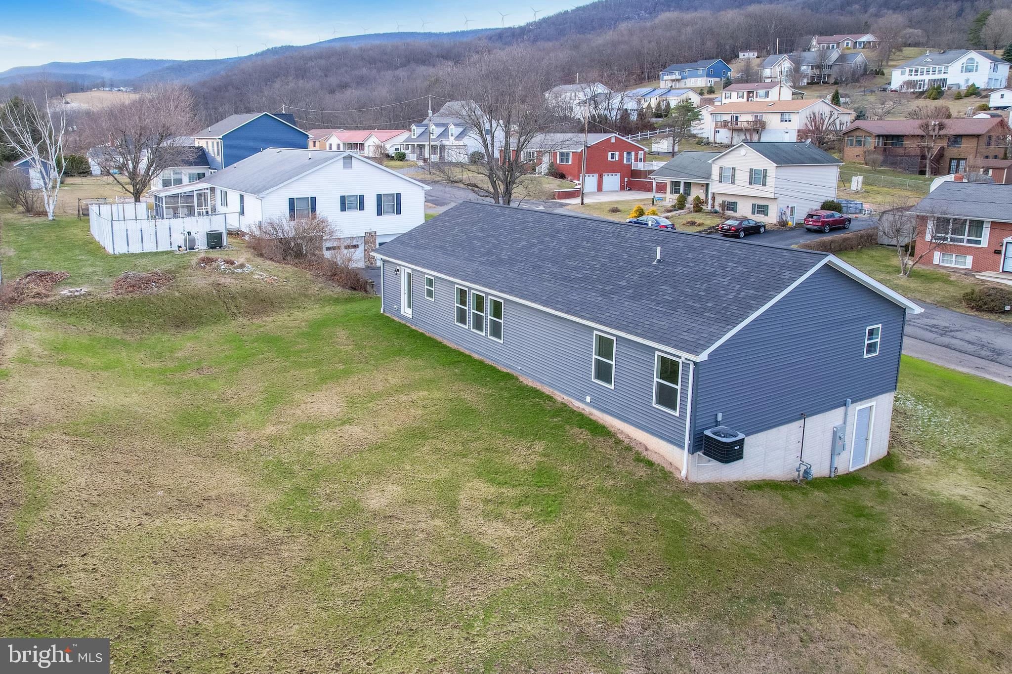 1525 Beacon Street Keyser, WV 26726 - Photo 58 of 59 a aerial view of residential houses with yard and mountain view in back