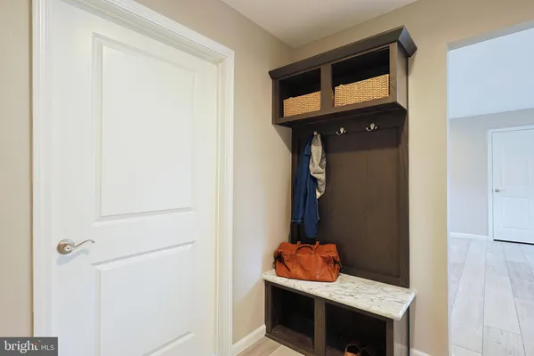 a spacious bathroom with a granite countertop sink and a mirror
