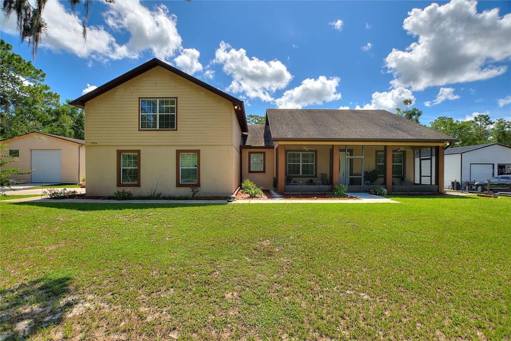 7094 Juniper Avenue Webster, FL 33597 - Photo 1 of 1 a view of a house with a backyard