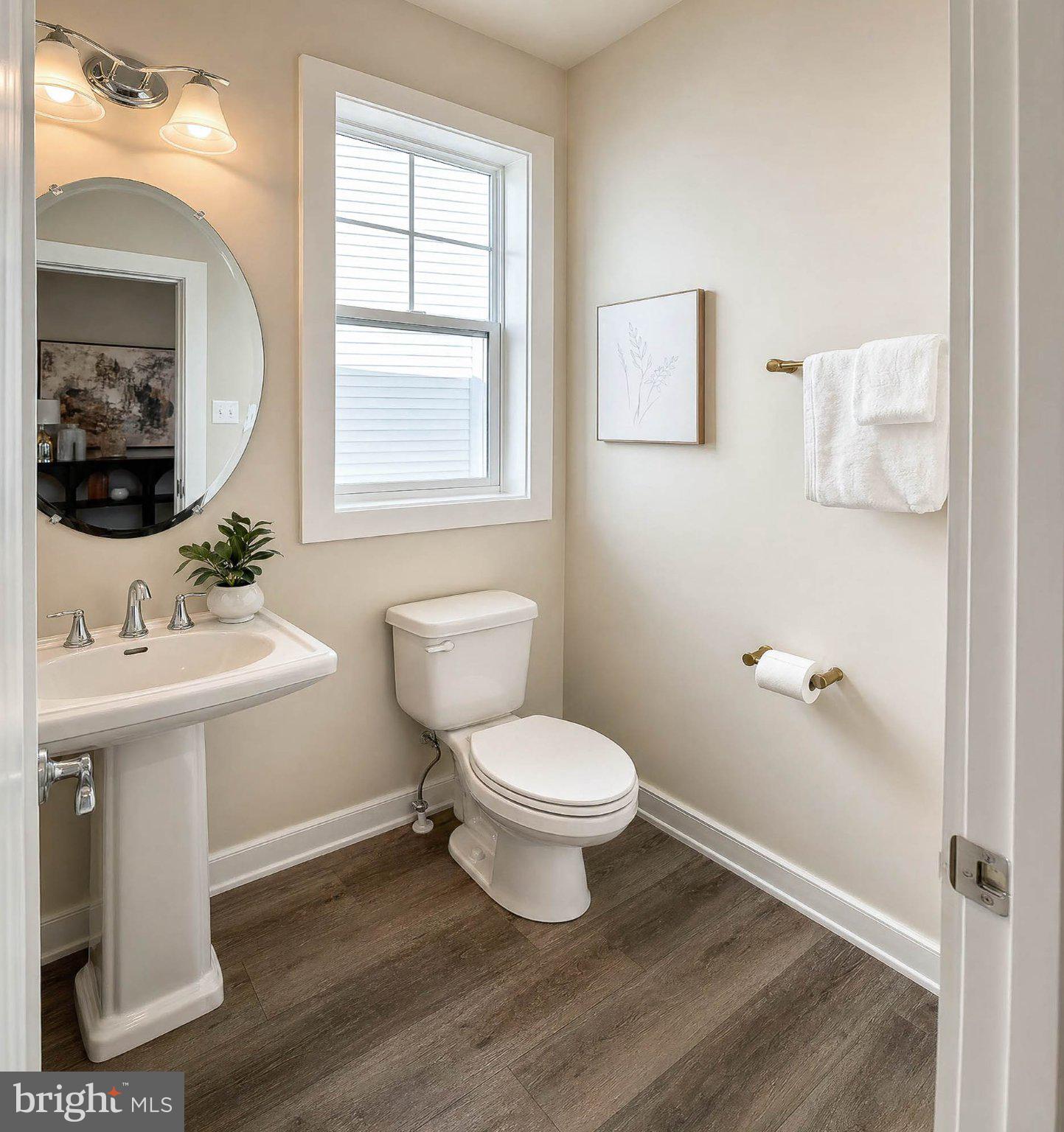 8785 Helleber Spring Circle Frederick, MD 21701 - Photo 13 of 49 a bathroom with a sink toilet a mirror and shower