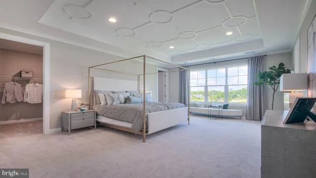 a spacious bedroom with a bed and a couch