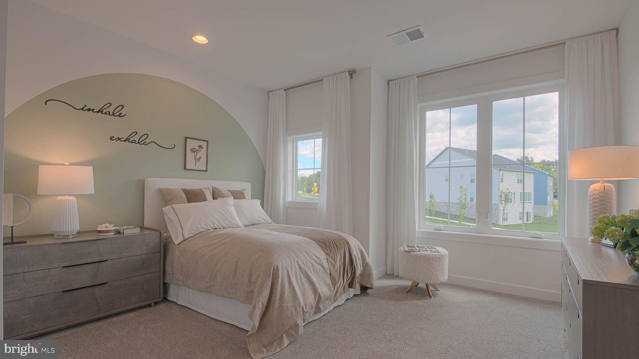 8785 Helleber Spring Circle Frederick, MD 21701 - Photo 17 of 22 a bedroom with a bed and a window