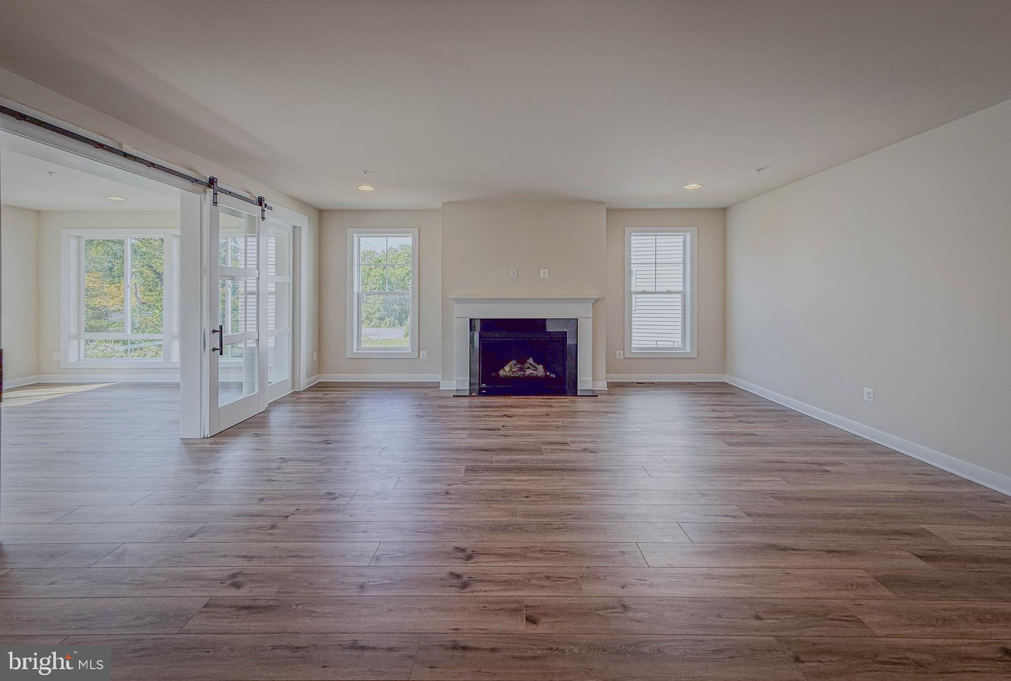 8785 Helleber Spring Circle Frederick, MD 21701 - Photo 19 of 49 Subject Property Great Rm-Gas Fireplace/Barn Door