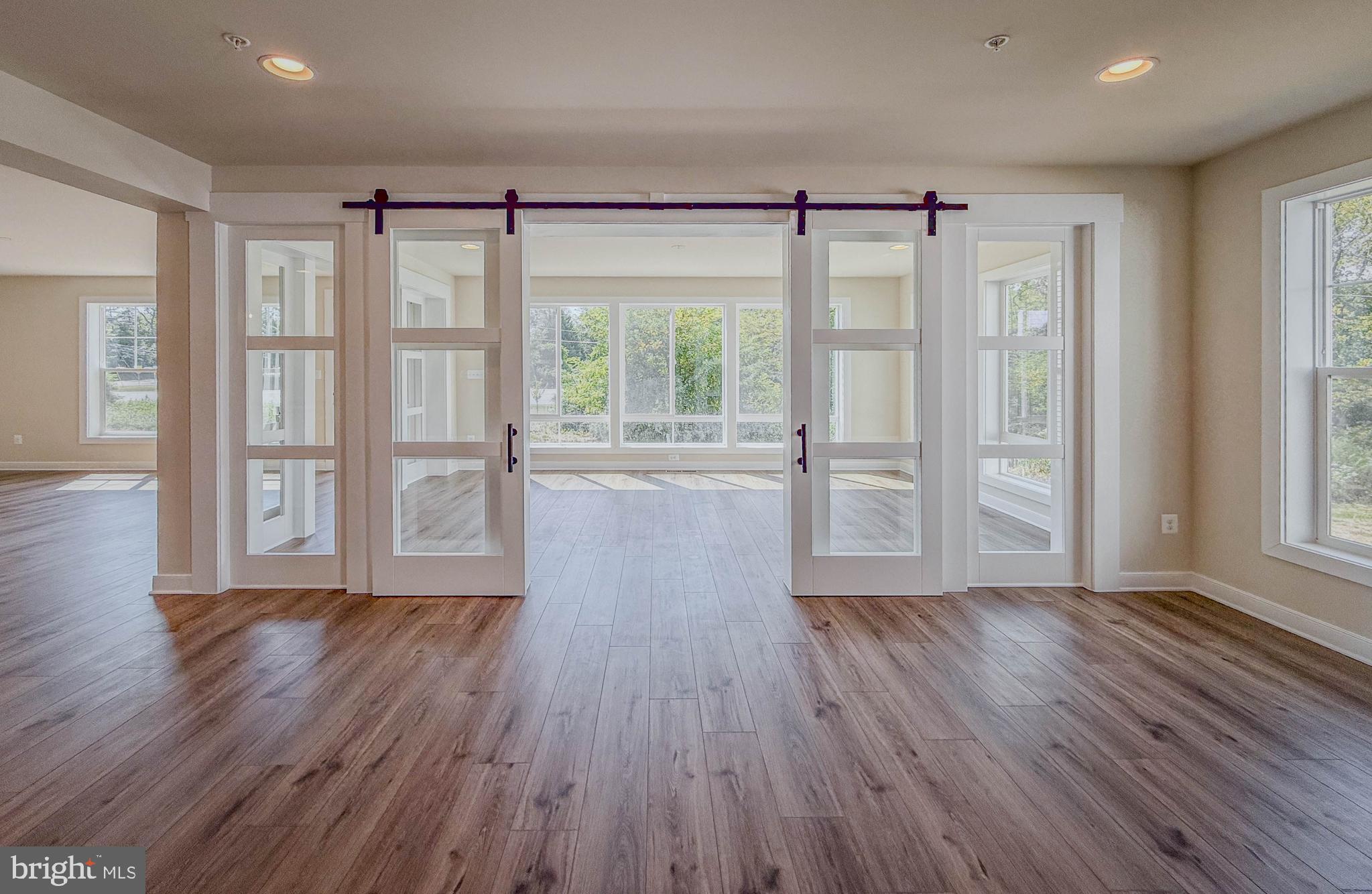 8785 Helleber Spring Circle Frederick, MD 21701 - Photo 21 of 49 wooden floor in an empty room with a window