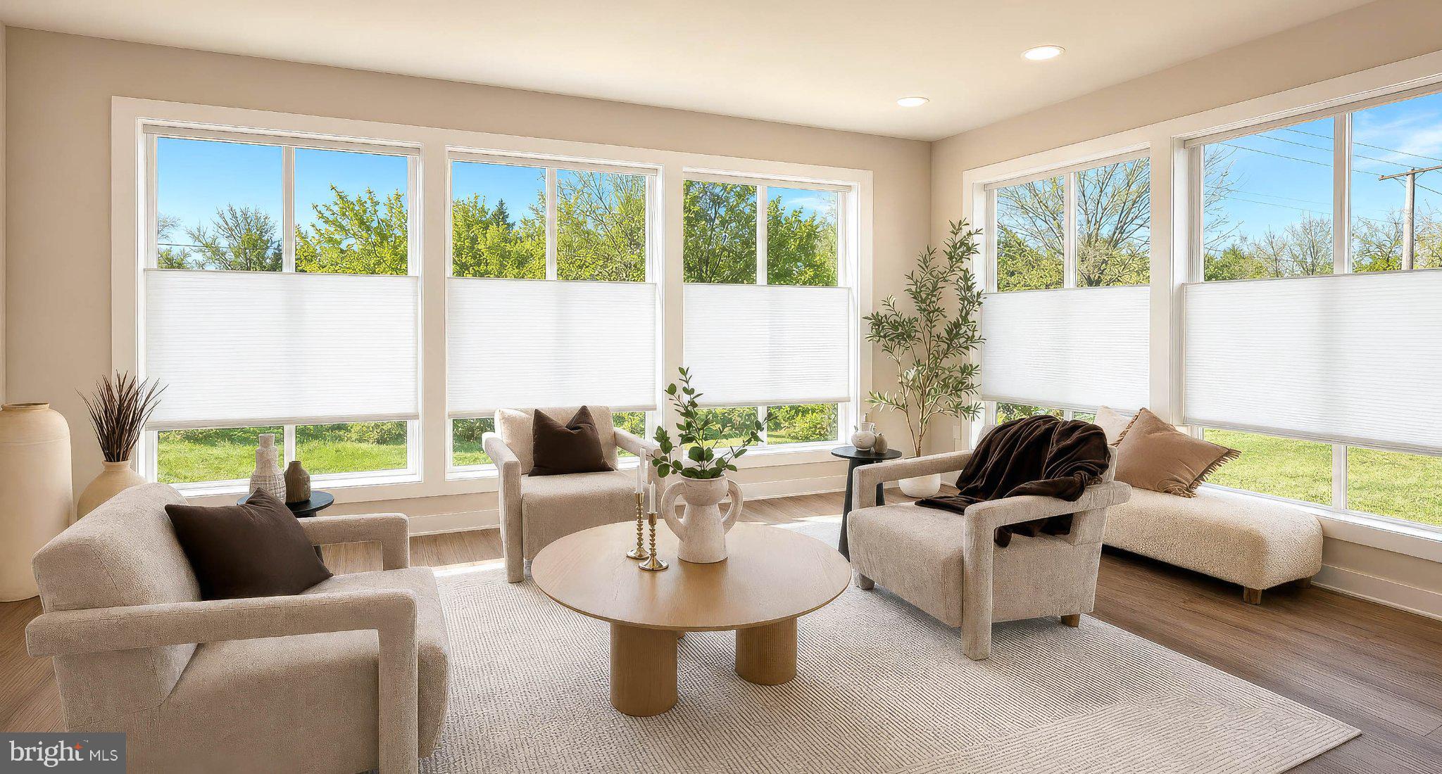 8785 Helleber Spring Circle Frederick, MD 21701 - Photo 23 of 49 a living room with furniture and a large window