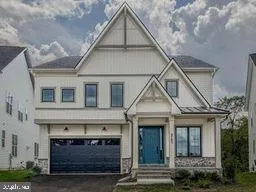 a front view of a house with garage