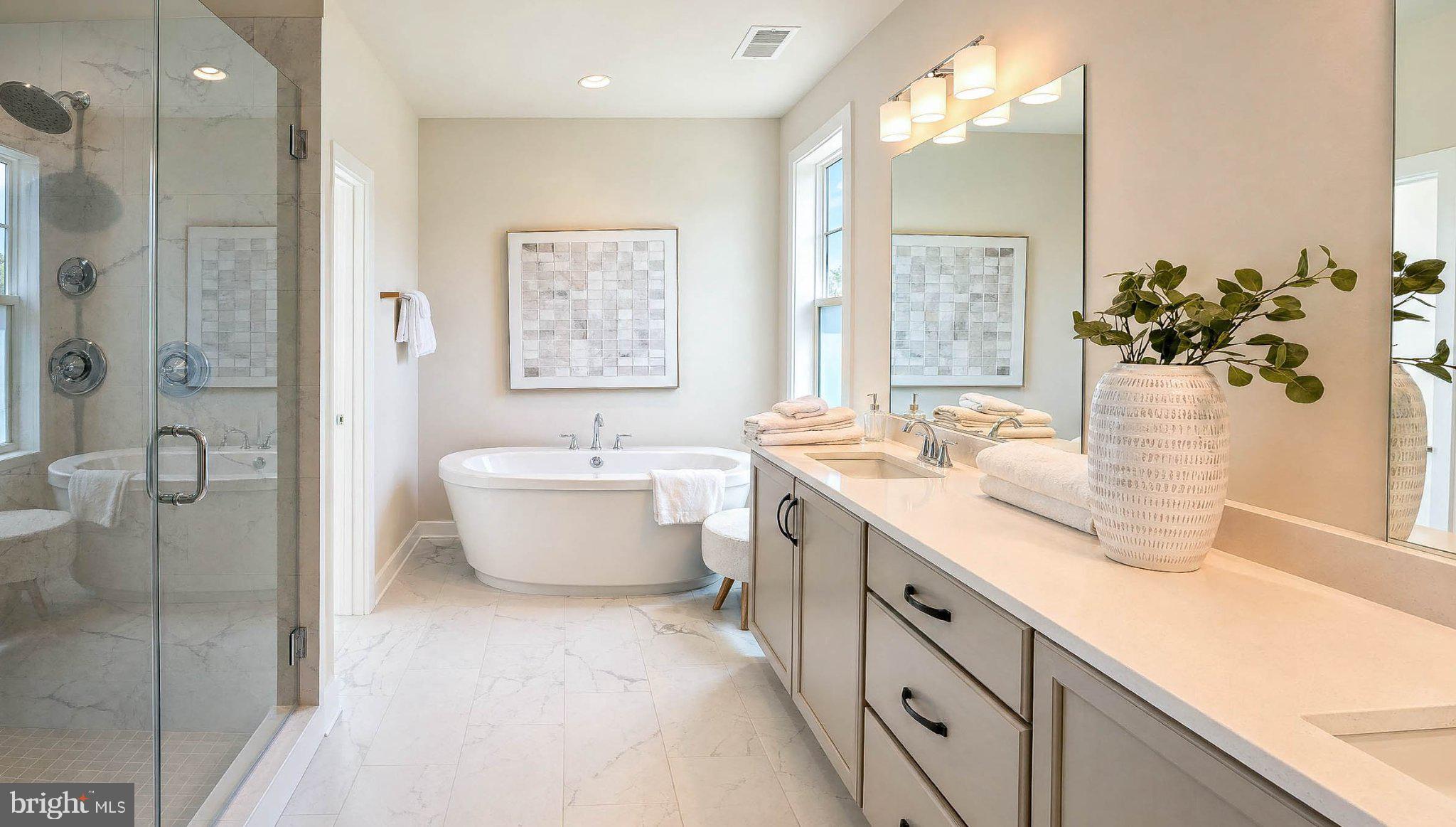 8785 Helleber Spring Circle Frederick, MD 21701 - Photo 31 of 49 a spacious bathroom with a double vanity sink mirror and shower