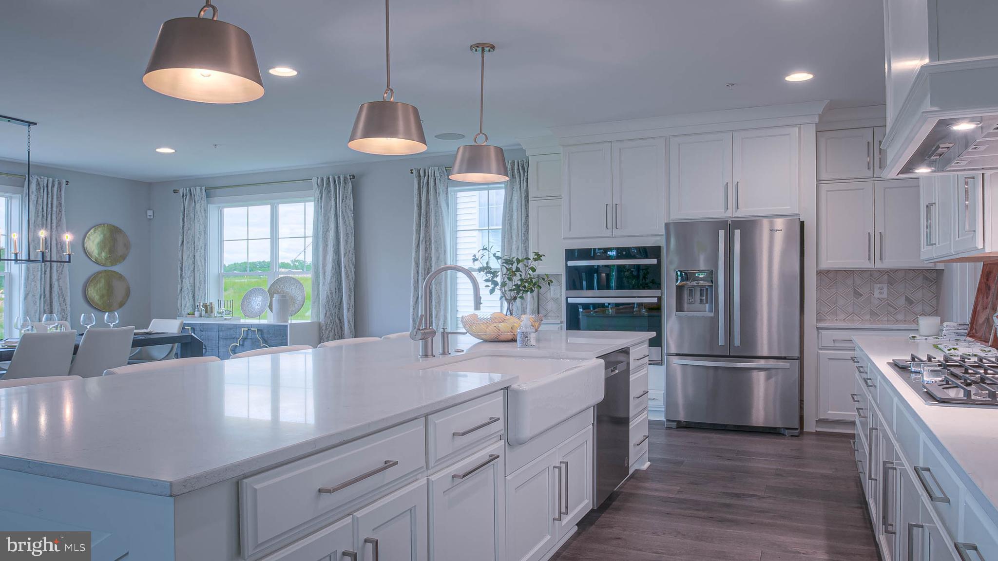 8785 Helleber Spring Circle Frederick, MD 21701 - Photo 6 of 22 a kitchen with refrigerator and cabinets