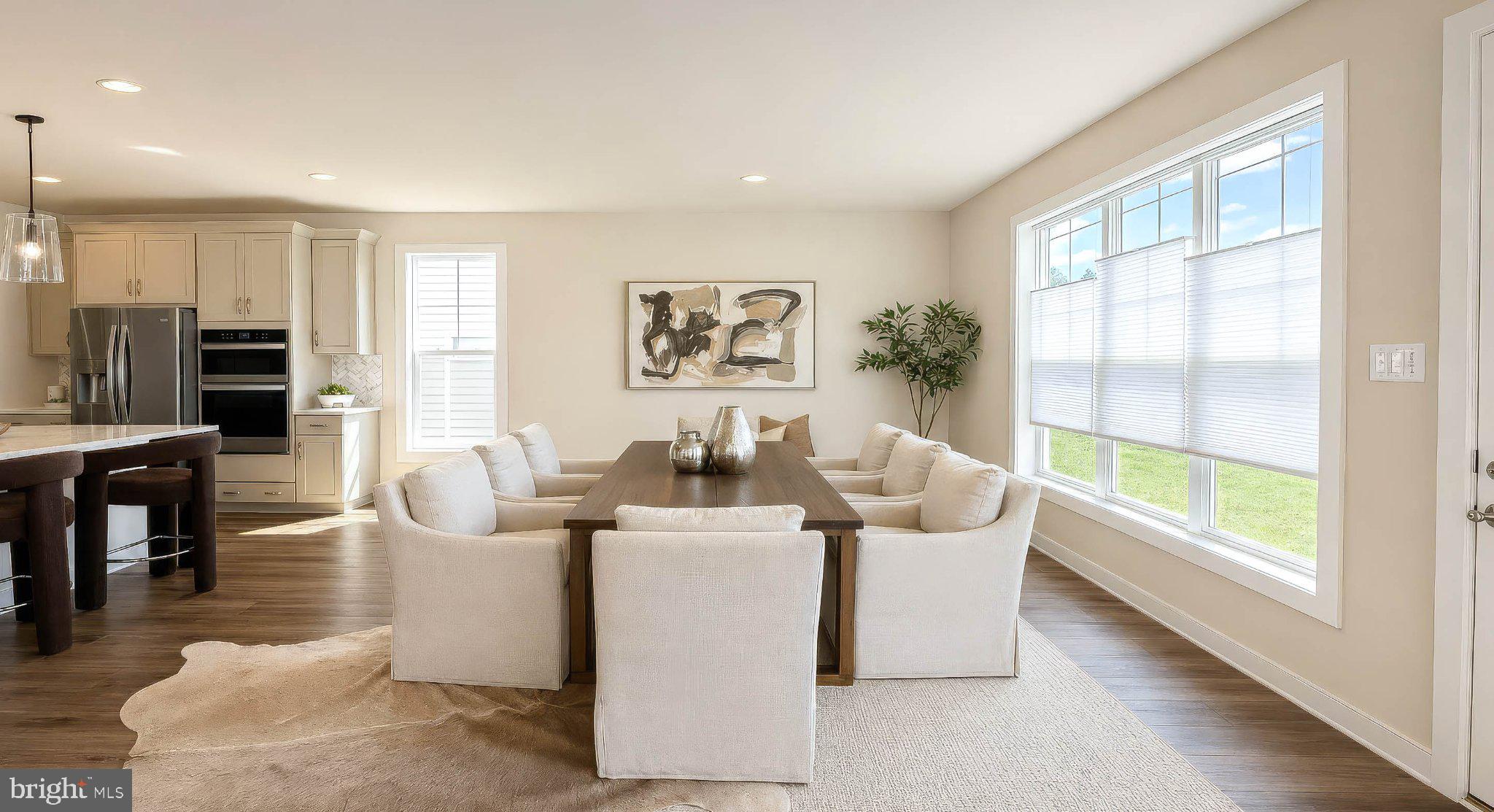 8785 Helleber Spring Circle Frederick, MD 21701 - Photo 6 of 49 Bright and inviting dining space.
