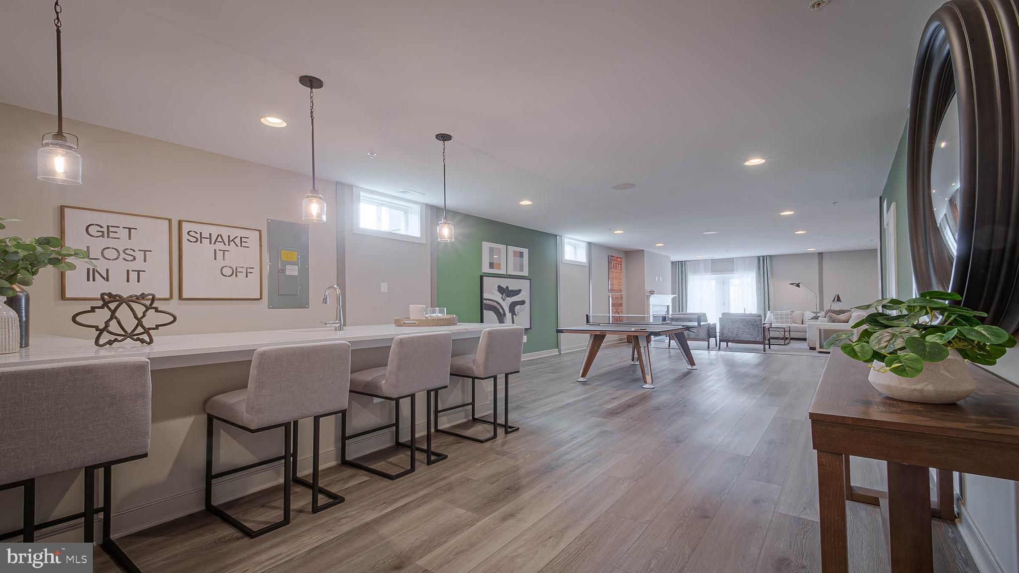 8785 Helleber Spring Circle Frederick, MD 21701 - Photo 7 of 22 a view of a dining room with furniture and wooden floor