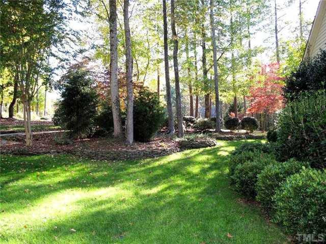 5801 Orchid Valley Road Raleigh, NC 27613 - Photo 23 of 25 Stacked stone wall outline garden/natural area. Would be perfect English Garden. Yard