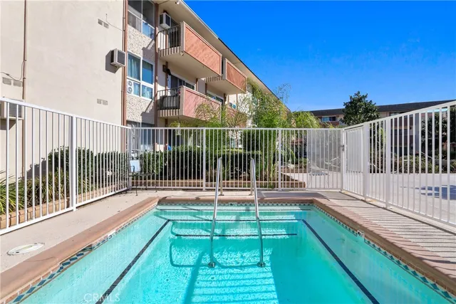a view of a street with a building in the background