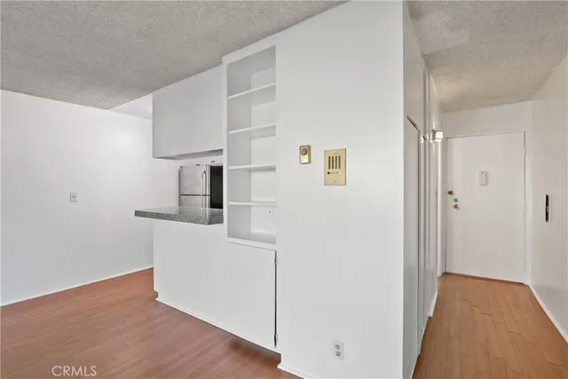 a view of hallway with wooden floor