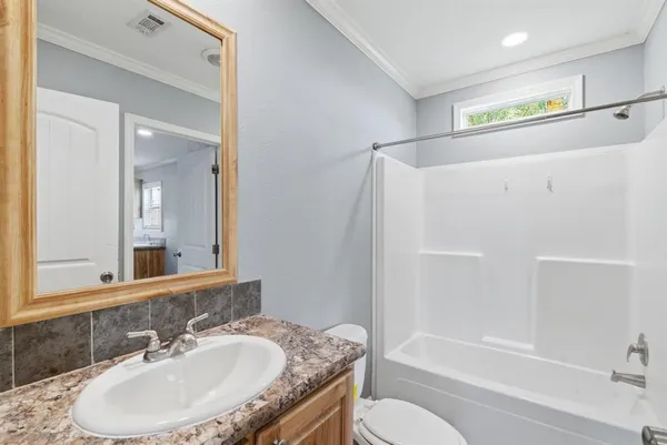 a view of a bathroom with a sink and mirror