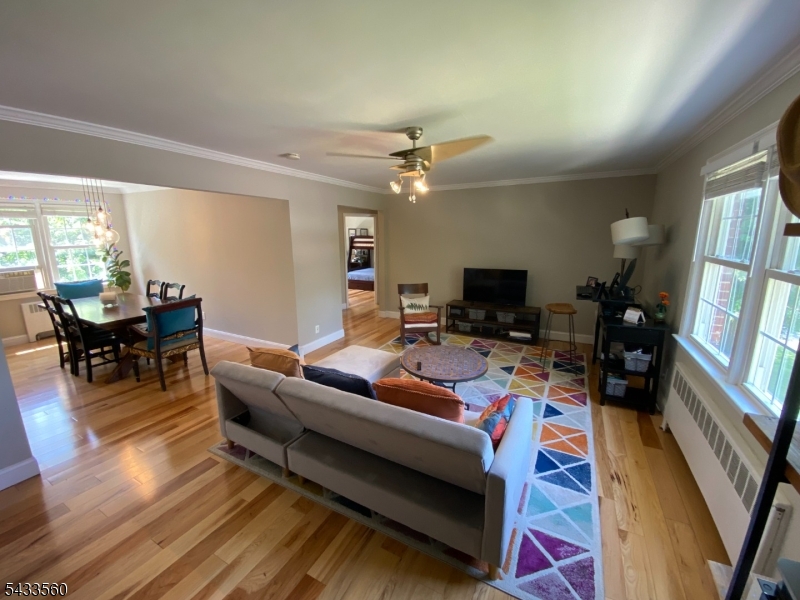 390 Morris Avenue, Unit 4 Summit, NJ 07901 - Photo 4 of 11 a living room with furniture and a flat screen tv