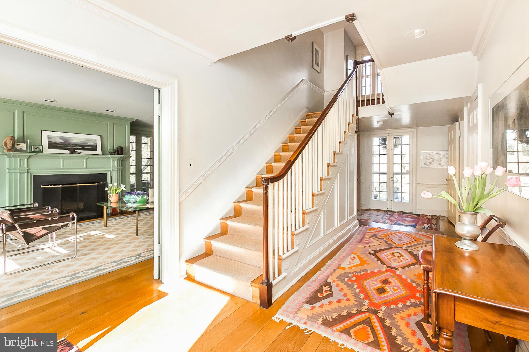 921 Bellemore Road Baltimore, MD 21210 - Photo 2 of 26 a view of an entryway with wooden floor and a livingroom view