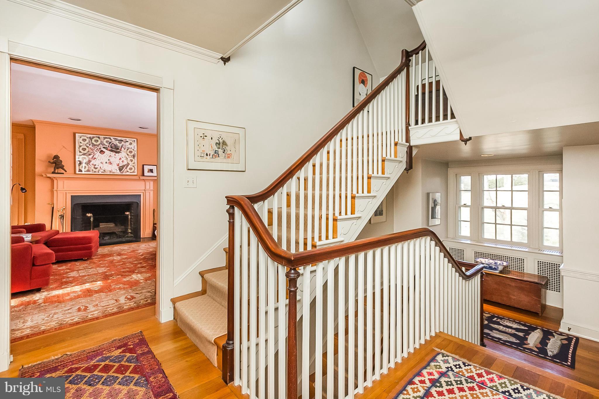 921 Bellemore Road Baltimore, MD 21210 - Photo 14 of 26 a view of a livingroom with furniture hardwood floor and staircase