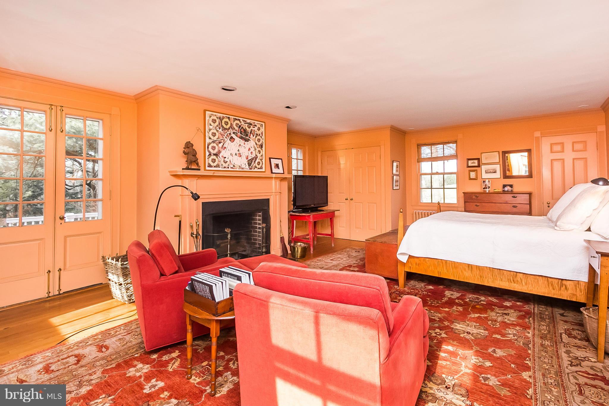 921 Bellemore Road Baltimore, MD 21210 - Photo 15 of 26 a bedroom with furniture and a fireplace