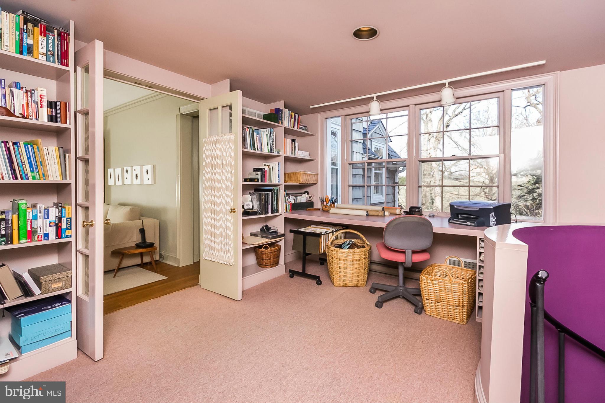 921 Bellemore Road Baltimore, MD 21210 - Photo 19 of 26 a view of a workspace with furniture and a bookshelf