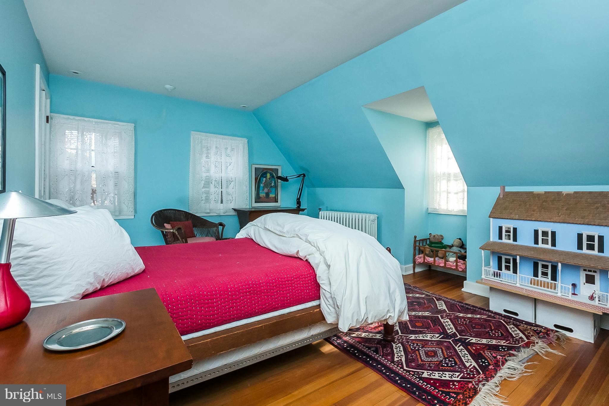 921 Bellemore Road Baltimore, MD 21210 - Photo 23 of 26 a bedroom with bed and a book shelf