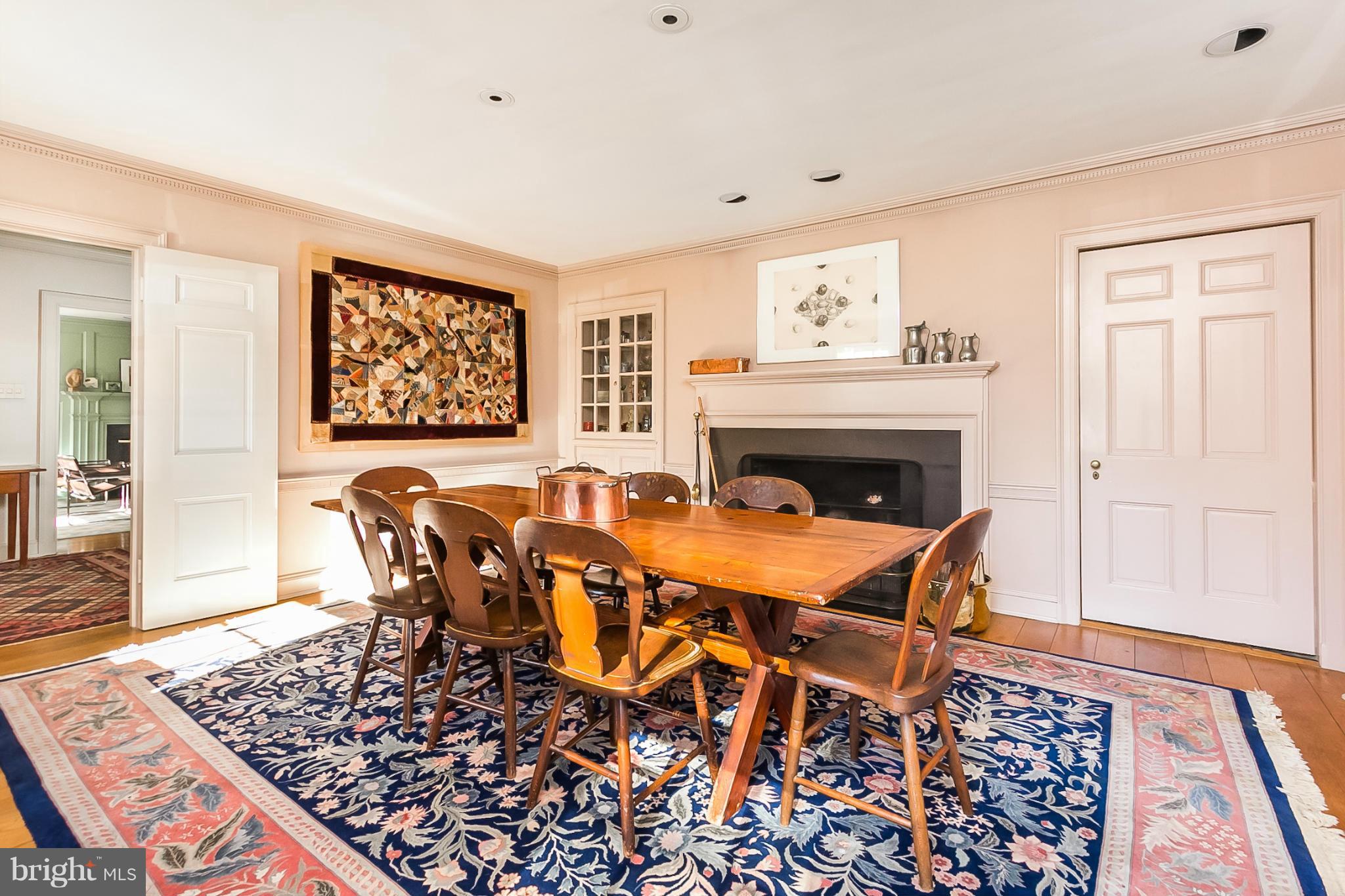 921 Bellemore Road Baltimore, MD 21210 - Photo 5 of 26 a dinning table and a fireplace in a room