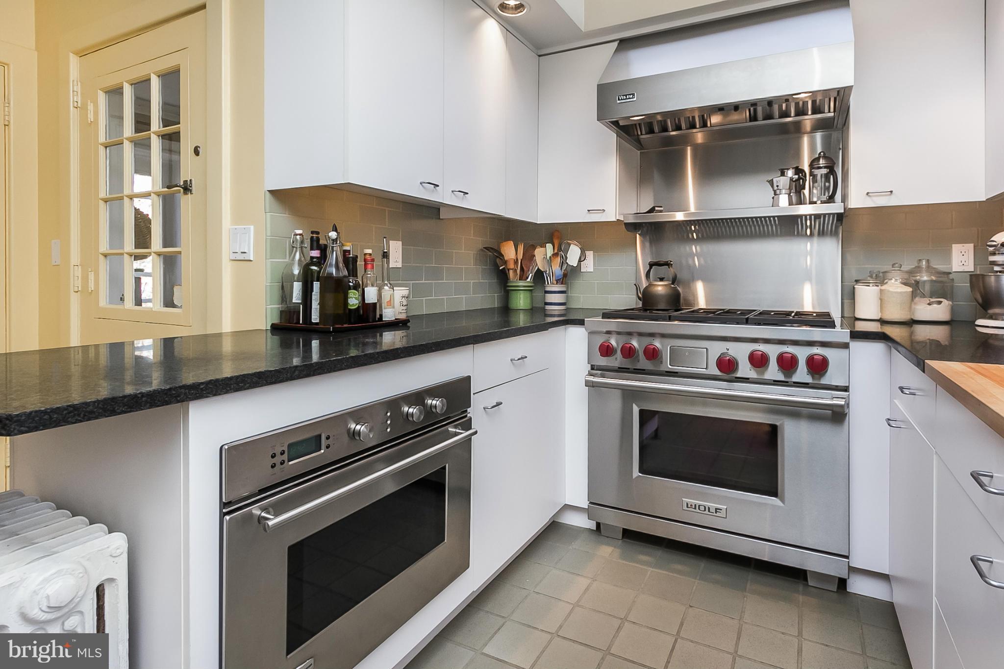 921 Bellemore Road Baltimore, MD 21210 - Photo 9 of 26 a kitchen with stainless steel appliances granite countertop a stove and a sink